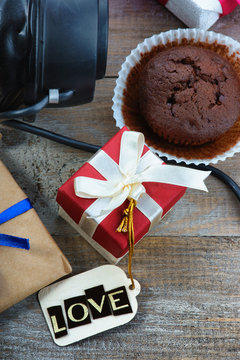 Chocolate muffin, gift boxes and label with word Love