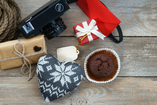 Gift boxes, muffin, photo camera and heart shapes