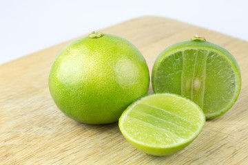 Limes on chopping block and cut in half