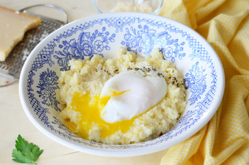 Millet Porridge with Poached Egg and Grated Cheese