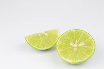 Half of limes on isolated white background