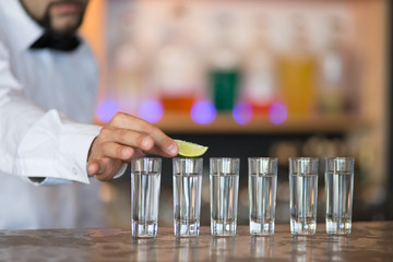 Barman at work, preparing cocktails.
