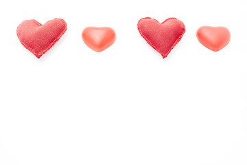 four red hearts on top of a white background