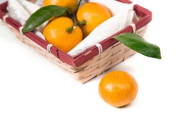Fresh orange mandarine with leaf isolated on white background