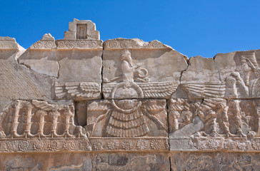 Ahura Mazda - relief of winged sun symbol of Zoroastrianism in ruined Persepolis