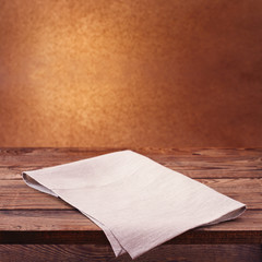 Empty wooden deck table with tablecloth