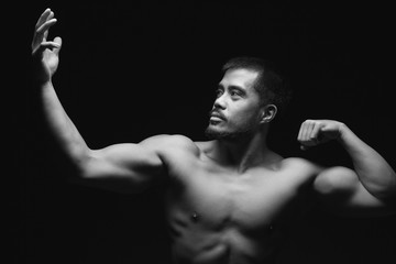 Fototapeta na wymiar Young asian man with muscular upper body