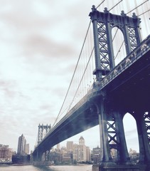Manhattan bridge over the river in vintage style, New York