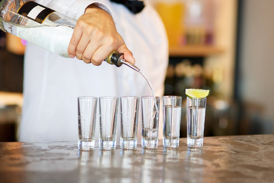 Barman at work, preparing cocktails.