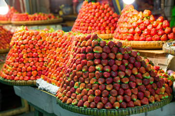 Row upon row of fresh, juicy  garden strawberries for retail sal