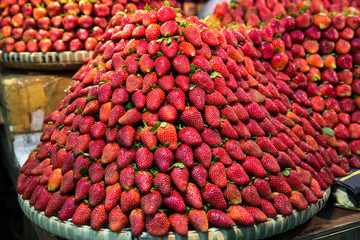 Row upon row of fresh, juicy  garden strawberries for retail sal