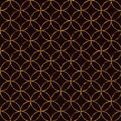 Fototapeta premium Seamless pattern based on japanese sashiko motifs. Golden color. Sashiko with fans. Abstract geometric backdrop. Sashiko motif - Seven Treasures (Shippo-Tsunagi). For decoration or printing on fabric.