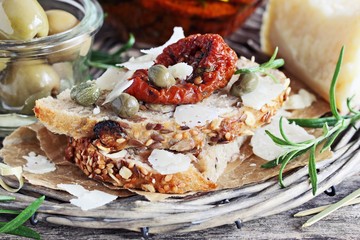 Mediterranean appetizers on a rustic wooden table.Selective focus