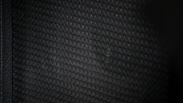 Guitar amp speaker vibrating.