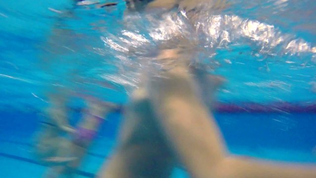 boy  teen dives pool into underwater swimming 