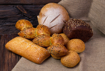 Assortment of baked bread on wooden