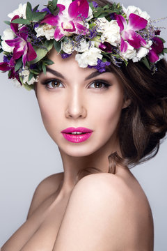 Beautiful woman portrait with flowers on head