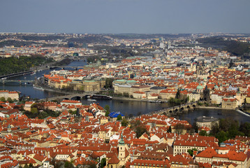 Fototapeta na wymiar PRAGUE, CZECH REPUBLIC - APRIL 24, 2013: The aerial view of Prague City and Charles Bridge from Petrin Hill
