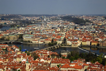 Fototapeta na wymiar PRAGUE, CZECH REPUBLIC - APRIL 24, 2013: The aerial view of Prague City and Charles Bridge from Petrin Hill
