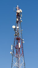 Broadcast Satellite Antenna Tower On Blue Sky