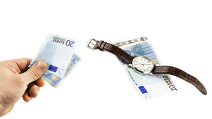 The euro in the hand and wrist watches