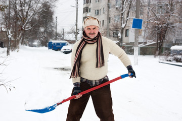 man removes snow