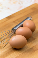 Kitchen metal wire and raw eggs