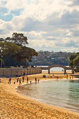 Families enjoy the winter sunshine at Balmoral Beach, Sydney.