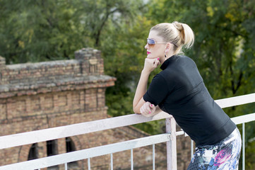 the woman's portrait on the bridge, over the old building