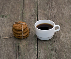 cup of coffee and linking of oatmeal cookies