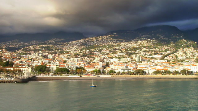 Time-lapse of a sailboat ancored by Barcelona.