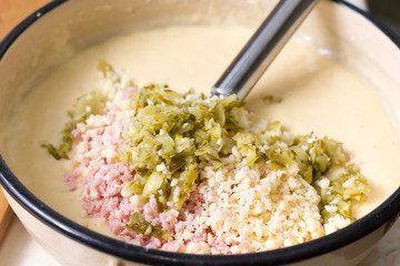 Chopped ham cucumber and cheese in the pie mixture