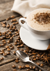 Hot coffee and pastries on a wooden background