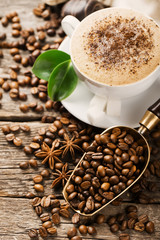 Hot coffee and pastries on a wooden background