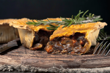Australian meat pie on the wooden table