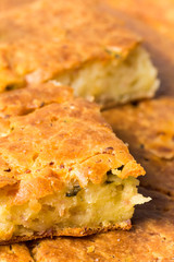 Macro view of homemade pie with ham cheese and cucumber