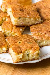 Macro view of homemade pie with ham cheese and cucumber