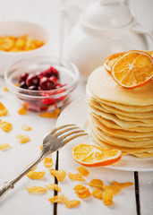 delicious pancakes on wooden table with fruits
