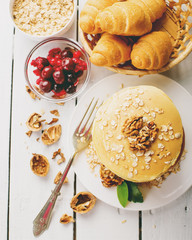 delicious pancakes on wooden table with fruits