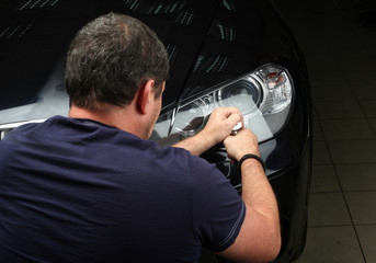 Car service. Polishing of optics of the car