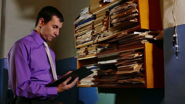 Accounting clerk said the paper work in the office of an old retro