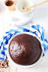 Cooked chocolate pie in a baking tray on a table, top view