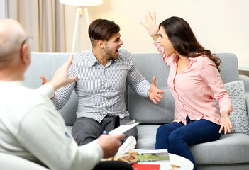 Young couple with problem on reception for family psychologist