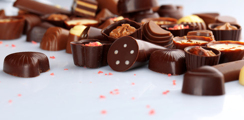 Assorted chocolate candies, isolated on white