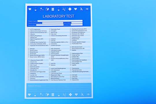 Laboratory test list on blue background, close up