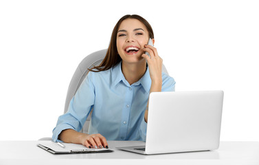 A beautiful woman talking on phone at the office, isolated on white