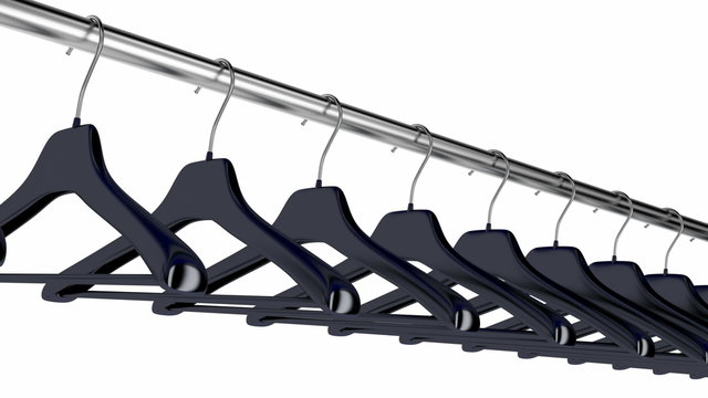 Plastic hangers hanging on rod