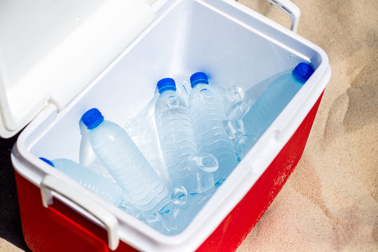 Bottles Of Water In The Ice Box On The Beach