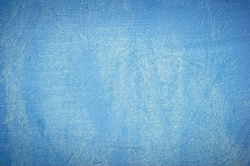 A blue colored old wall texture background.