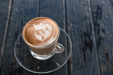 Cup of latte Coffee on wood table